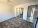 Bedroom features mirrored closet doors and neutral-toned carpet at 1304 Bonita Ave, Las Vegas, NV 89104
