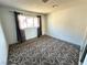 Bedroom features patterned carpet, and natural light at 1304 Bonita Ave, Las Vegas, NV 89104
