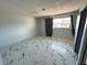 Spacious bedroom featuring sleek marble floors, natural light and neutral wall color at 1304 Bonita Ave, Las Vegas, NV 89104