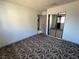 Bedroom features mirrored closet doors and neutral-toned carpet at 1304 Bonita Ave, Las Vegas, NV 89104