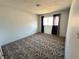 Bedroom features patterned carpet and ample natural light at 1304 Bonita Ave, Las Vegas, NV 89104