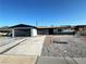 Charming single-story home featuring a spacious driveway and low-maintenance desert landscaping in the front yard at 1304 Bonita Ave, Las Vegas, NV 89104