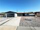 Charming single-story home featuring a well-maintained yard and a spacious driveway leading to the attached garage at 1304 Bonita Ave, Las Vegas, NV 89104