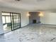 Spacious living room with marble-like tile flooring and a decorative brick fireplace at 1304 Bonita Ave, Las Vegas, NV 89104