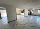 Bright living room with marble-like tile flooring that flows seamlessly into the updated kitchen at 1304 Bonita Ave, Las Vegas, NV 89104