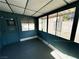 Enclosed sunroom featuring windows and a door, offering a versatile space for relaxation or entertaining at 1304 Bonita Ave, Las Vegas, NV 89104