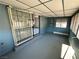 Cozy sunroom featuring durable flooring, multiple windows, and a secure gated entrance, providing a secure and bright space at 1304 Bonita Ave, Las Vegas, NV 89104