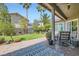 Inviting backyard patio with manicured lawn, lush landscaping, and shaded seating area, ideal for outdoor entertaining at 1314 Doggett Ave, Las Vegas, NV 89123