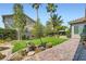 Expansive backyard with lush green lawn, mature trees, manicured landscaping and inviting patio for outdoor living at 1314 Doggett Ave, Las Vegas, NV 89123