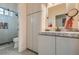 Well-lit bathroom with a glass-enclosed shower and modern vanity at 1314 Doggett Ave, Las Vegas, NV 89123
