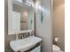 Stylish powder room with modern vanity and decorative mirror at 1314 Doggett Ave, Las Vegas, NV 89123
