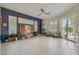 Spacious bonus room with tile floors, natural light, and a ceiling fan at 1314 Doggett Ave, Las Vegas, NV 89123