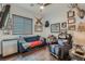 Inviting den with a comfortable seating area, unique decor, and tile floors at 1314 Doggett Ave, Las Vegas, NV 89123