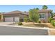 Well-maintained single-story home featuring a three-car garage and mature landscaping at 1314 Doggett Ave, Las Vegas, NV 89123