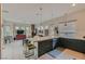 Stylish kitchen with modern island seating, flowing into a spacious living area with ample light at 1314 Doggett Ave, Las Vegas, NV 89123