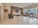 Bright living room with neutral tones, tile flooring, and plantation shutters at 1314 Doggett Ave, Las Vegas, NV 89123