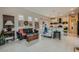 Comfortable open-concept living room with abundant natural light, flowing into the kitchen at 1314 Doggett Ave, Las Vegas, NV 89123