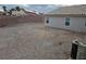 Backyard featuring privacy wall and partial view of the home's exterior at 1345 N Hollywood Blvd, Las Vegas, NV 89110