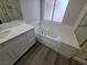 Bathroom showcasing a soaking tub, shower, and white vanity with quartz counters at 1345 N Hollywood Blvd, Las Vegas, NV 89110