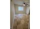 Neutral bedroom with tile floors, ceiling fan, and window with blinds at 1345 N Hollywood Blvd, Las Vegas, NV 89110