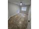 Neutral bedroom with tile floors, ceiling fan, and window with blinds at 1345 N Hollywood Blvd, Las Vegas, NV 89110