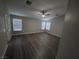 Large bedroom with neutral walls, wood-look flooring, and abundant natural light at 1345 N Hollywood Blvd, Las Vegas, NV 89110