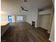 Bright living room features wood-look flooring, a fireplace, and neutral paint at 1345 N Hollywood Blvd, Las Vegas, NV 89110