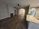 Spacious living room with fireplace and wood-look flooring, open to the kitchen at 1345 N Hollywood Blvd, Las Vegas, NV 89110