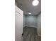 Walk-in closet with wood-look flooring and ample shelving at 1345 N Hollywood Blvd, Las Vegas, NV 89110