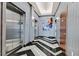 Hallway with stainless steel elevators, modern lighting, art, and unique zigzag flooring for a luxurious feel at 150 Las Vegas Blvd # 1004, Las Vegas, NV 89101