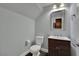 Powder room with modern vanity and mirror, toilet, and light fixture at 1525 Spiced Wine Ave # 12103, Henderson, NV 89074