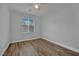 This bedroom has wood floors, a ceiling fan, and a window at 1525 Spiced Wine Ave # 12103, Henderson, NV 89074