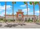 A charming clubhouse framed by palm trees and colorful landscaping at 1525 Spiced Wine Ave # 12103, Henderson, NV 89074