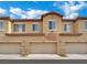 Townhome garages offer convenient parking, each clearly numbered with the unit address above at 1525 Spiced Wine Ave # 12103, Henderson, NV 89074