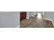 Spacious hallway with wood-look flooring, neutral walls, and built-in storage at 1525 Spiced Wine Ave # 12103, Henderson, NV 89074