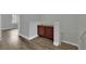 Hallway with wood-look flooring, neutral walls, and built-in storage at the stairs at 1525 Spiced Wine Ave # 12103, Henderson, NV 89074