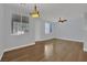 Spacious living area with hardwood floors, bright windows, and stylish light fixture at 1525 Spiced Wine Ave # 12103, Henderson, NV 89074