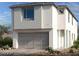 Modern two-story home features a neutral color palette, a two car garage, and large windows at 1543 Pacific Baza St, Las Vegas, NV 89138