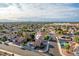 Charming community aerial view with desert landscaping and stunning Las Vegas skyline at 155 Fallon Dr, Henderson, NV 89074