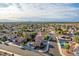 Charming community aerial view with desert landscaping and stunning Las Vegas skyline at 155 Fallon Dr, Henderson, NV 89074