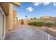 Private backyard area featuring brickwork, hardscape, and mature landscaping at 155 Fallon Dr, Henderson, NV 89074