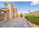 Private backyard featuring a covered patio, mature landscaping, and hardscape design at 155 Fallon Dr, Henderson, NV 89074