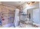 Cozy bathroom features tiled shower and vanity with granite countertop, offering a functional space at 155 Fallon Dr, Henderson, NV 89074
