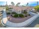 Inviting single-story home with desert landscaping and a two-car garage at 155 Fallon Dr, Henderson, NV 89074