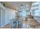 Bright kitchen with white cabinets, granite countertops, stainless steel appliances, and a center island at 155 Fallon Dr, Henderson, NV 89074