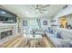 Inviting living room with a fireplace, built-in shelves, and sliding glass doors with backyard view at 155 Fallon Dr, Henderson, NV 89074