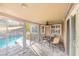 Enclosed patio featuring tile floors, sliding glass doors to the pool, and ceiling fan at 155 Fallon Dr, Henderson, NV 89074