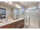 Spacious bathroom with double sinks and a glass-enclosed shower at 173 Petaluma Valley Dr, Las Vegas, NV 89138
