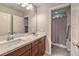 Bathroom featuring double sinks and an adjoined bath and toilet separated by a door at 173 Petaluma Valley Dr, Las Vegas, NV 89138