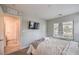 Bright bedroom with a TV, large window, and a neutral color scheme at 173 Petaluma Valley Dr, Las Vegas, NV 89138